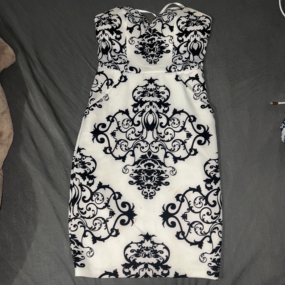 Womens strapless white and black dress with slight stains at the bottom